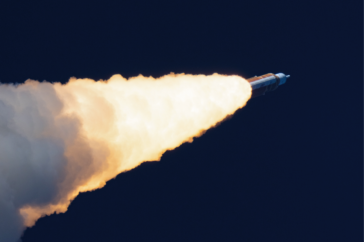 A rocket launching against a dark sky